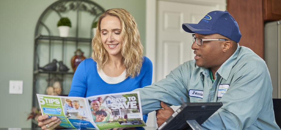 Customer going over a brochure that talks about the Home Solutions Program 
